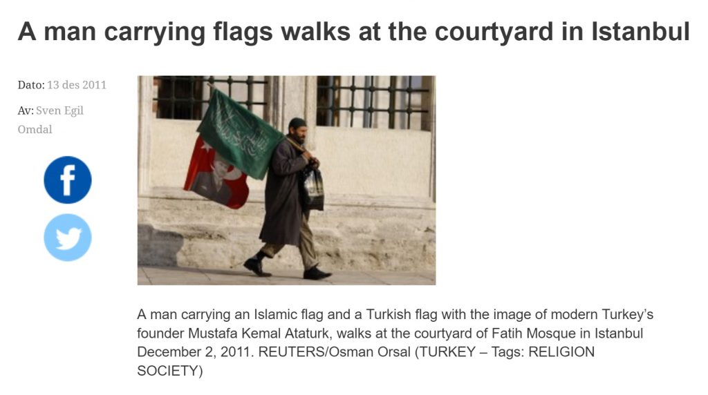 Man Carrying Islamic Flag and Ataturk picture